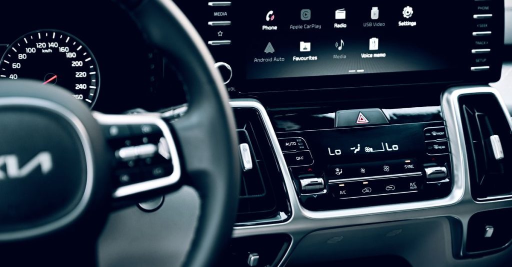 Close-up view of a luxury car's dashboard featuring a modern touchscreen display and advanced features.