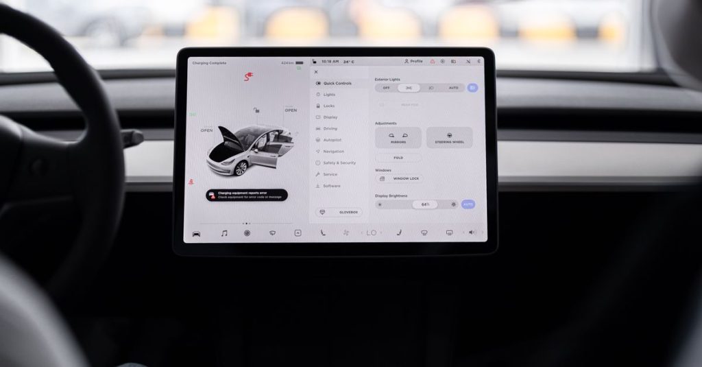 View of a modern car's dashboard featuring a digital display panel with control options.