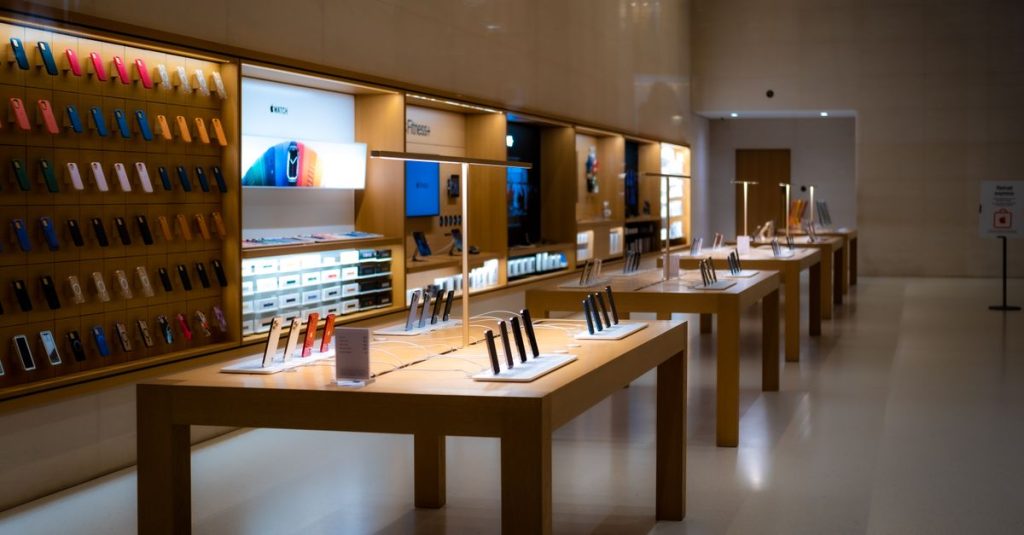 Sleek interior of a high-tech store showcasing various mobile devices and accessories.