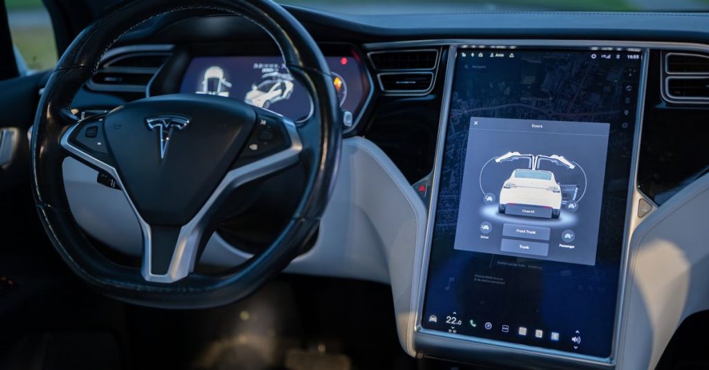 Interior shot of a modern electric car showcasing a sleek design and advanced touchscreen technology.