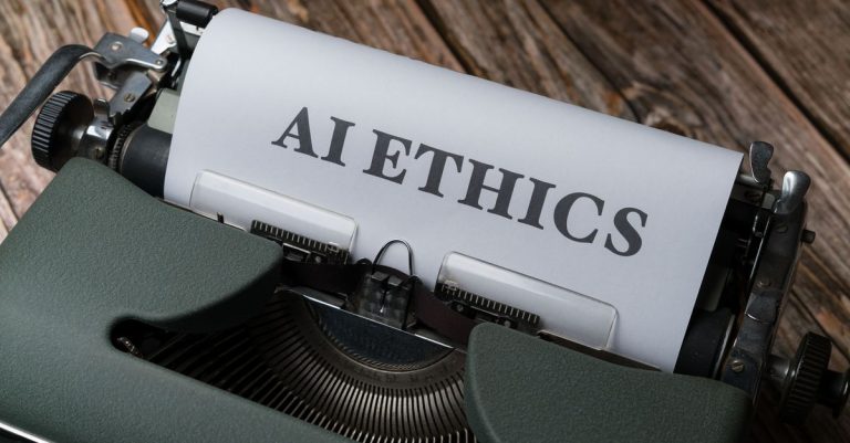 Retro typewriter with 'AI Ethics' on paper, conveying technology themes.