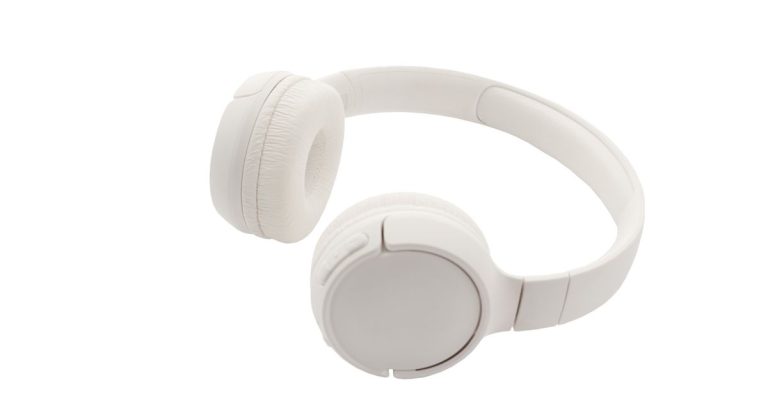 Sleek white wireless headphones against a white backdrop, showcasing minimalist design and modern technology.