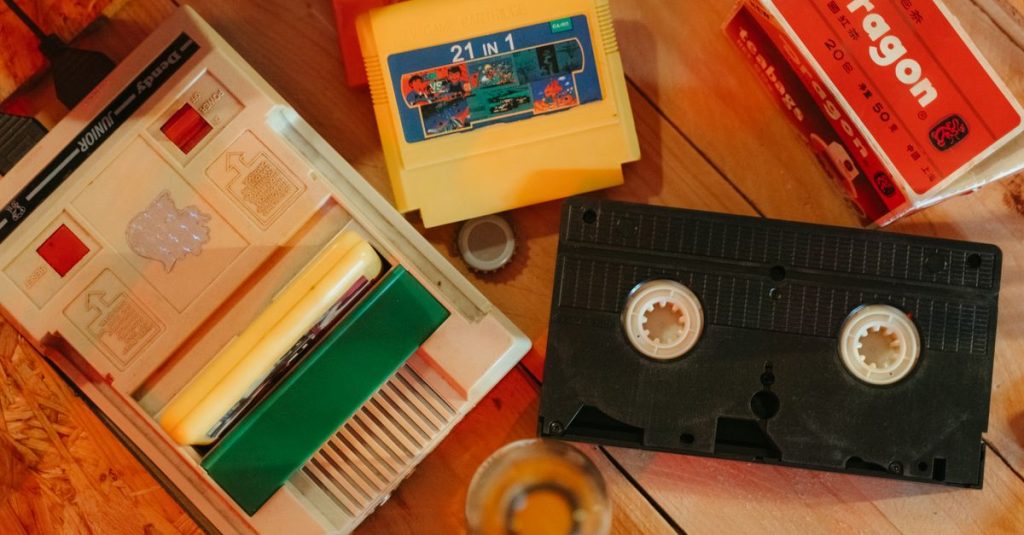 Vintage gaming console with cartridges and VHS tape on wooden surface, nostalgic theme.