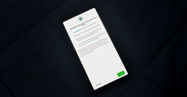 Close-up of smartphone screen showing a privacy policy update agreement.