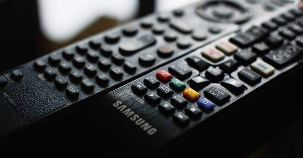 Detailed close-up of a Samsung remote control showcasing buttons and logo.