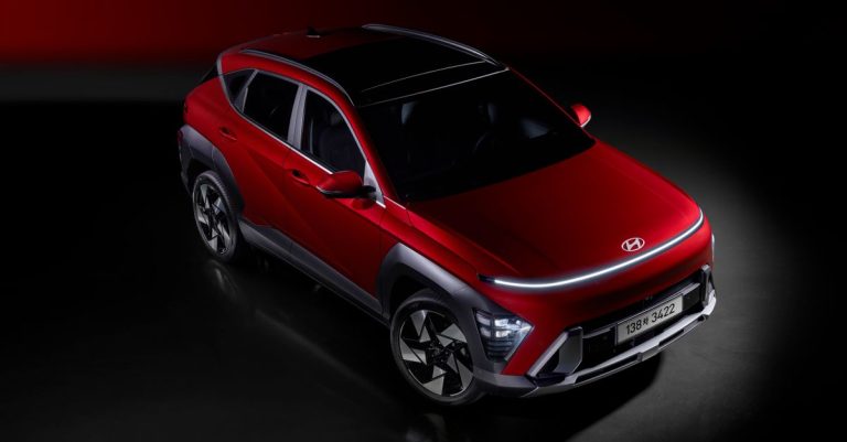 A striking red SUV with contemporary design elements and dynamic lighting, emphasizing modern automotive innovation.