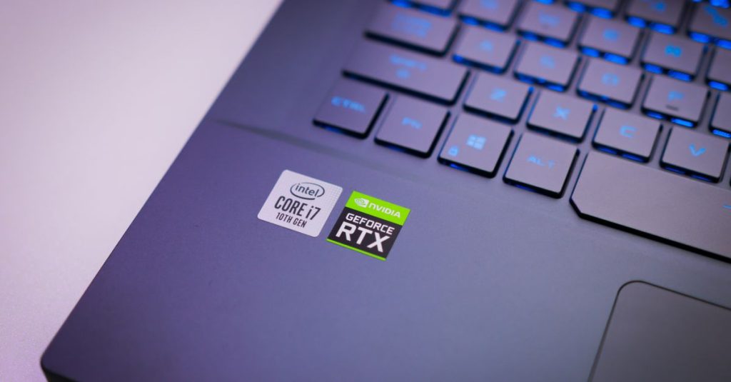 Laptop keyboard with Intel Core i7 and NVIDIA GeForce RTX stickers, symbolizing high-performance computing power.