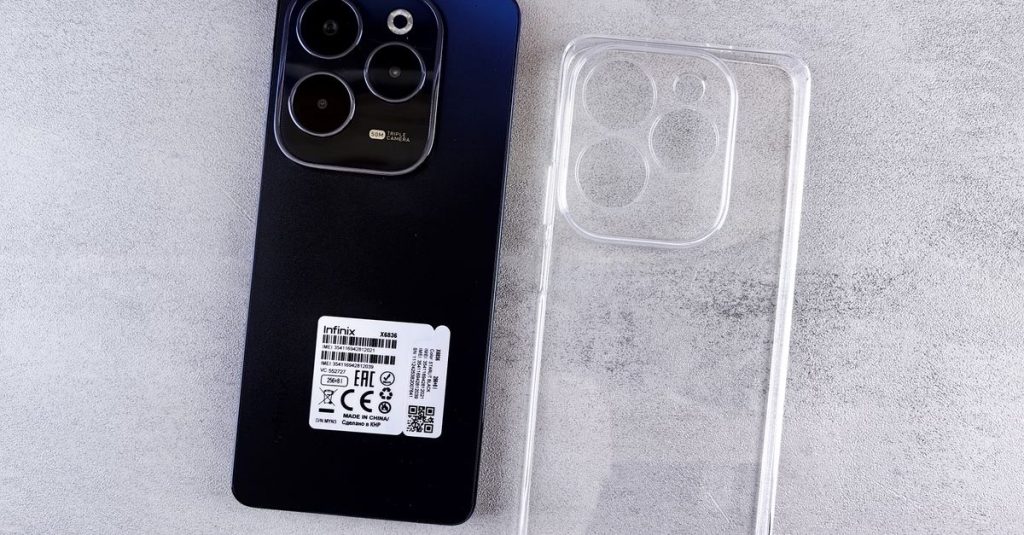 Top view of Infinix Hot 40 Pro smartphone with transparent clear case on a light background.