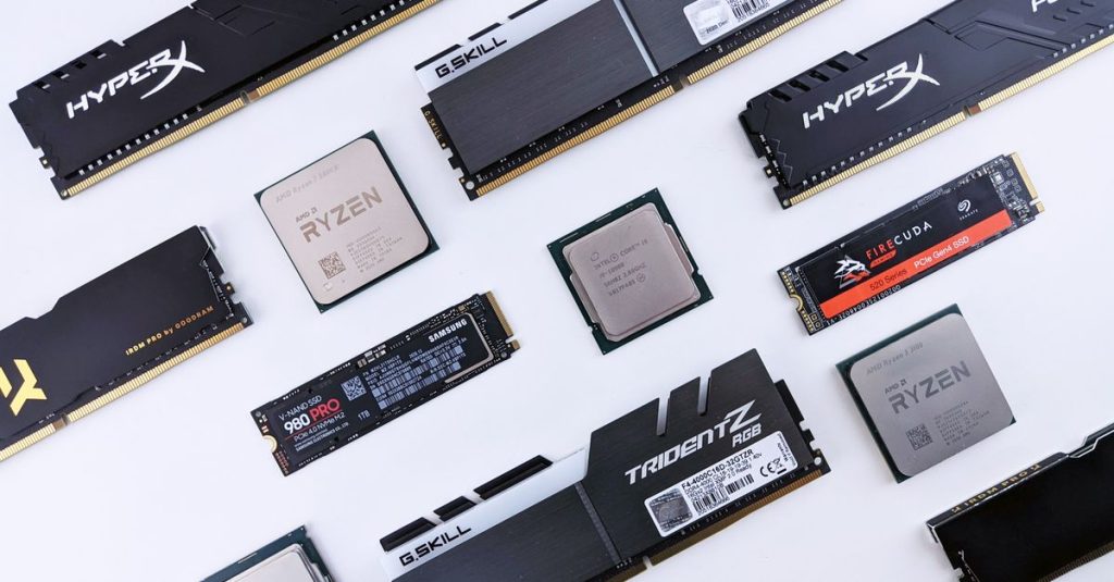 High-quality image of various computer components, including RAM and CPUs, on a white background.