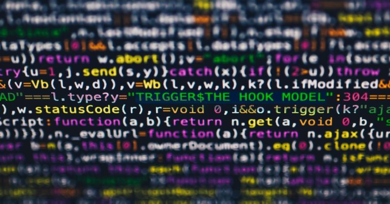 Vibrant close-up of multicolor programming code lines displayed on a screen.