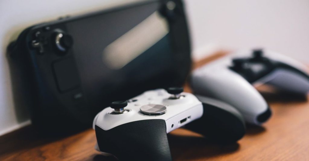 Stylish setup of gaming controllers and console on wooden surface.