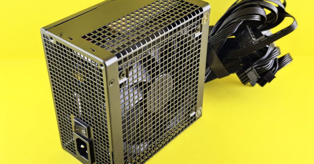 A powerful gaming PSU on yellow background, ideal for desktop setups.