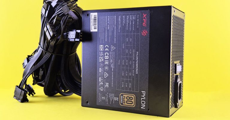 Black PC power supply unit with cables on a vibrant yellow backdrop. Ideal tech image.
