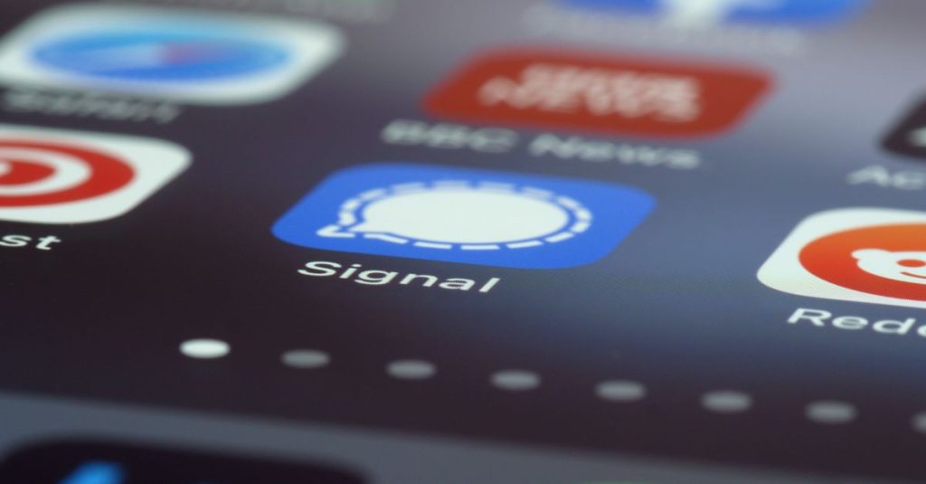 Detailed view of various app icons on a smartphone screen highlighting Signal app.